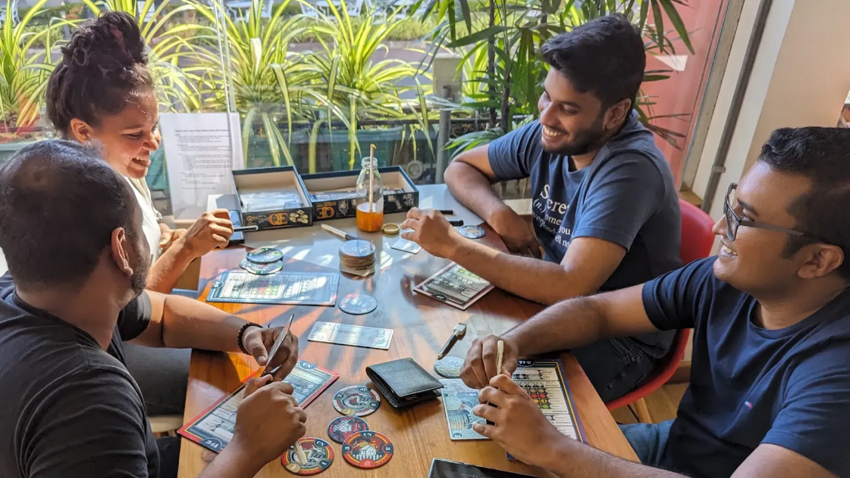 A bunch of friends playing QE the board game