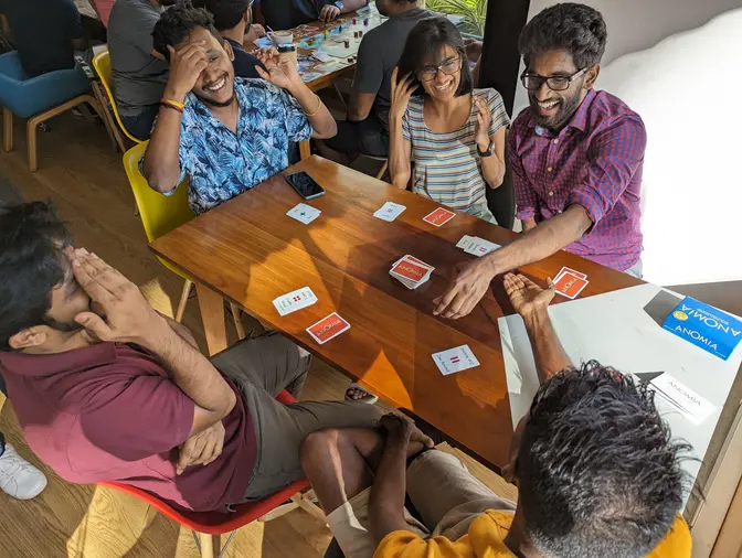 A group of people playing Anomia